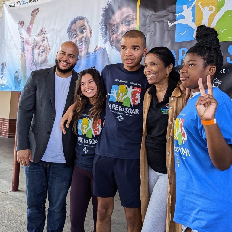 Isaac Bryan with young people and volunteers at a Dare to Soar event